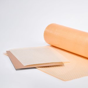 The picture shows a sheet with a smooth surface and other flat pieces cut to size in orange.