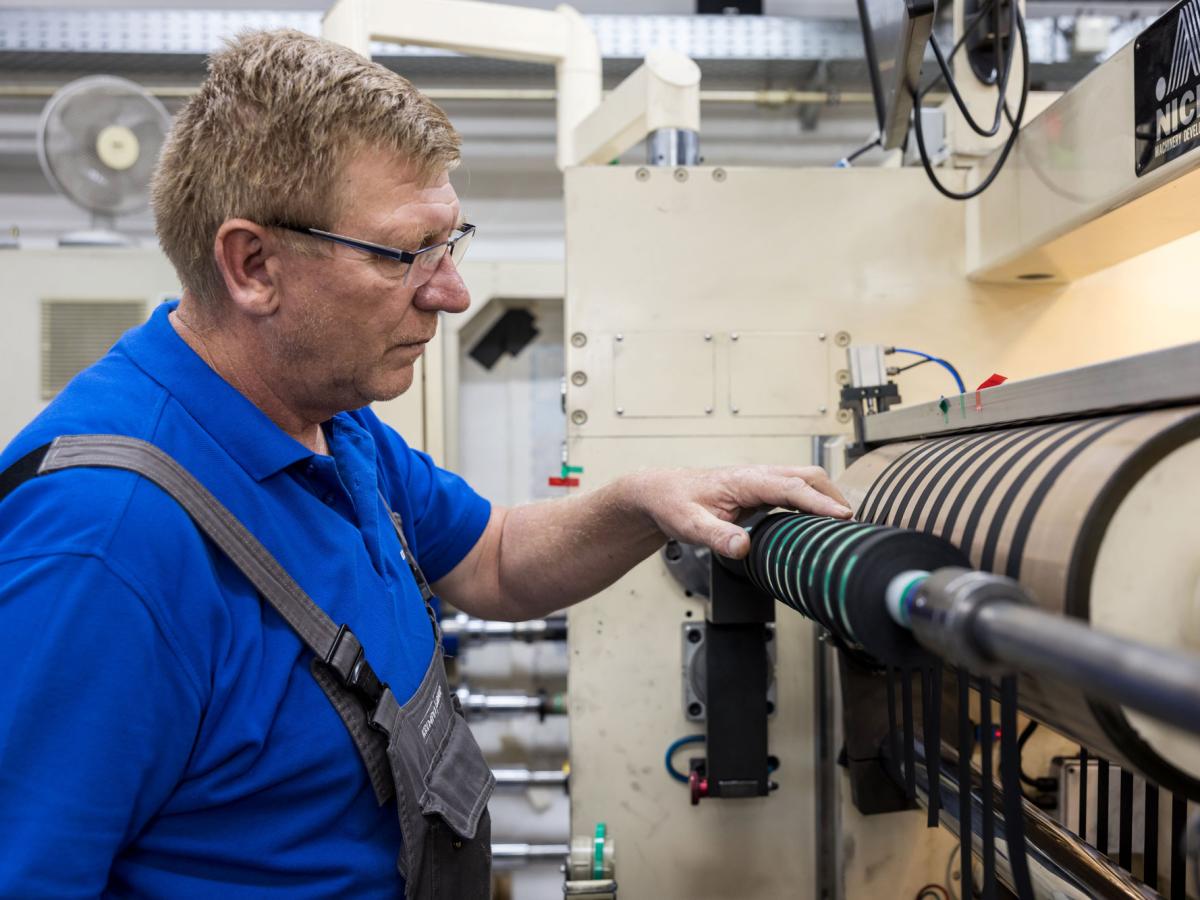 Man working on a machine in a production area